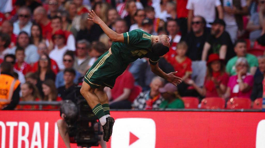 Daniel Bennett does a backflip celebration after scoring for AFC Whyteleafe at Wembley