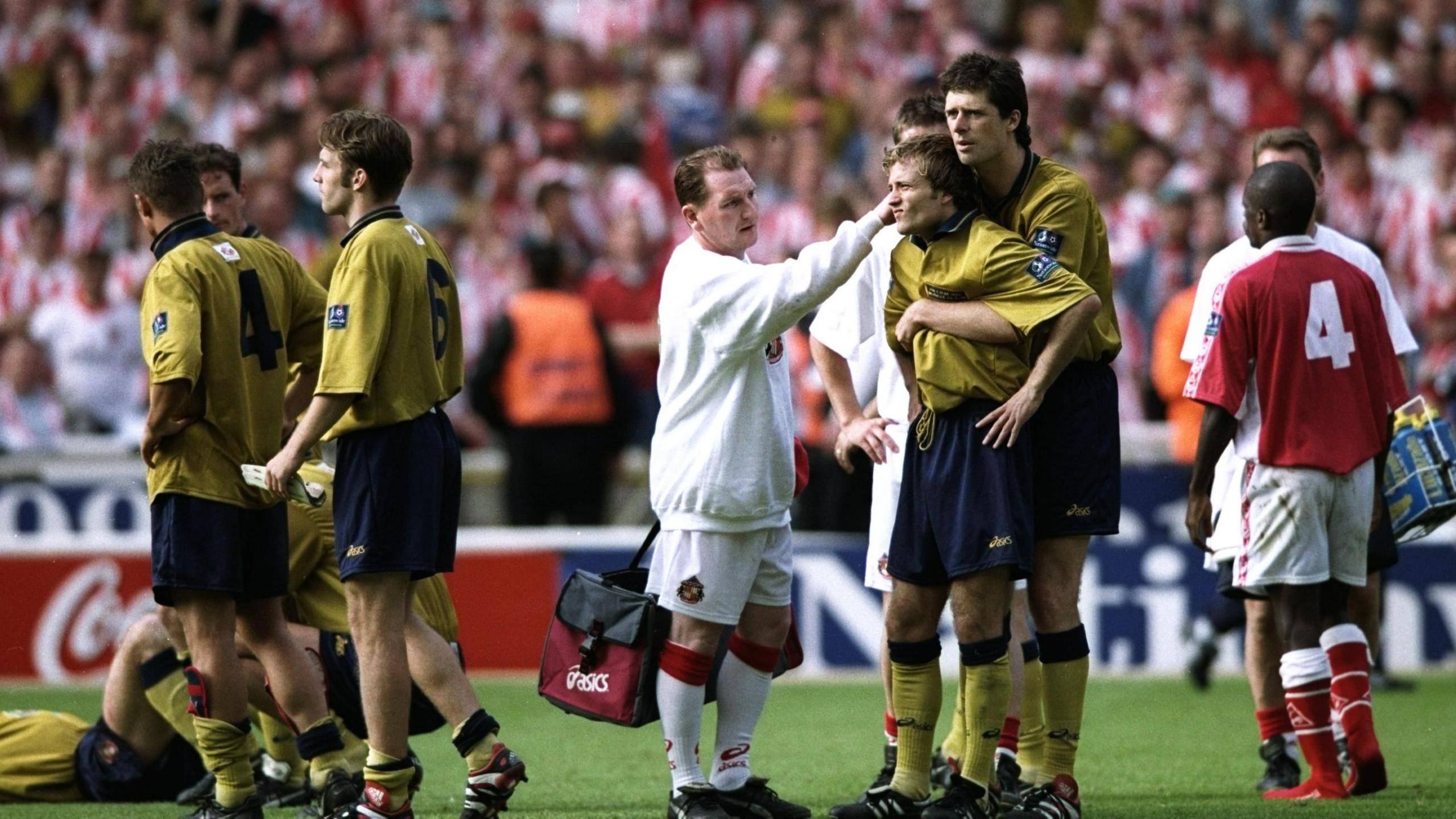 Niall Quinn hugs Sunderland's Michael Gray after the 1998 play-off final