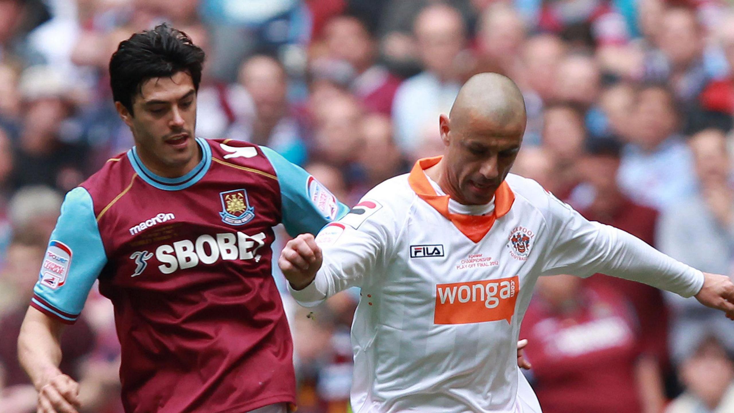 Kevin Phillips tries to shield the ball from West Ham defender James Tomkins