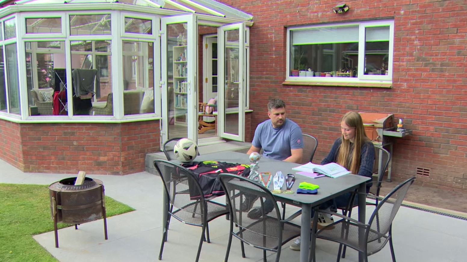 Abbie Smith with father Neil Smith in her garden