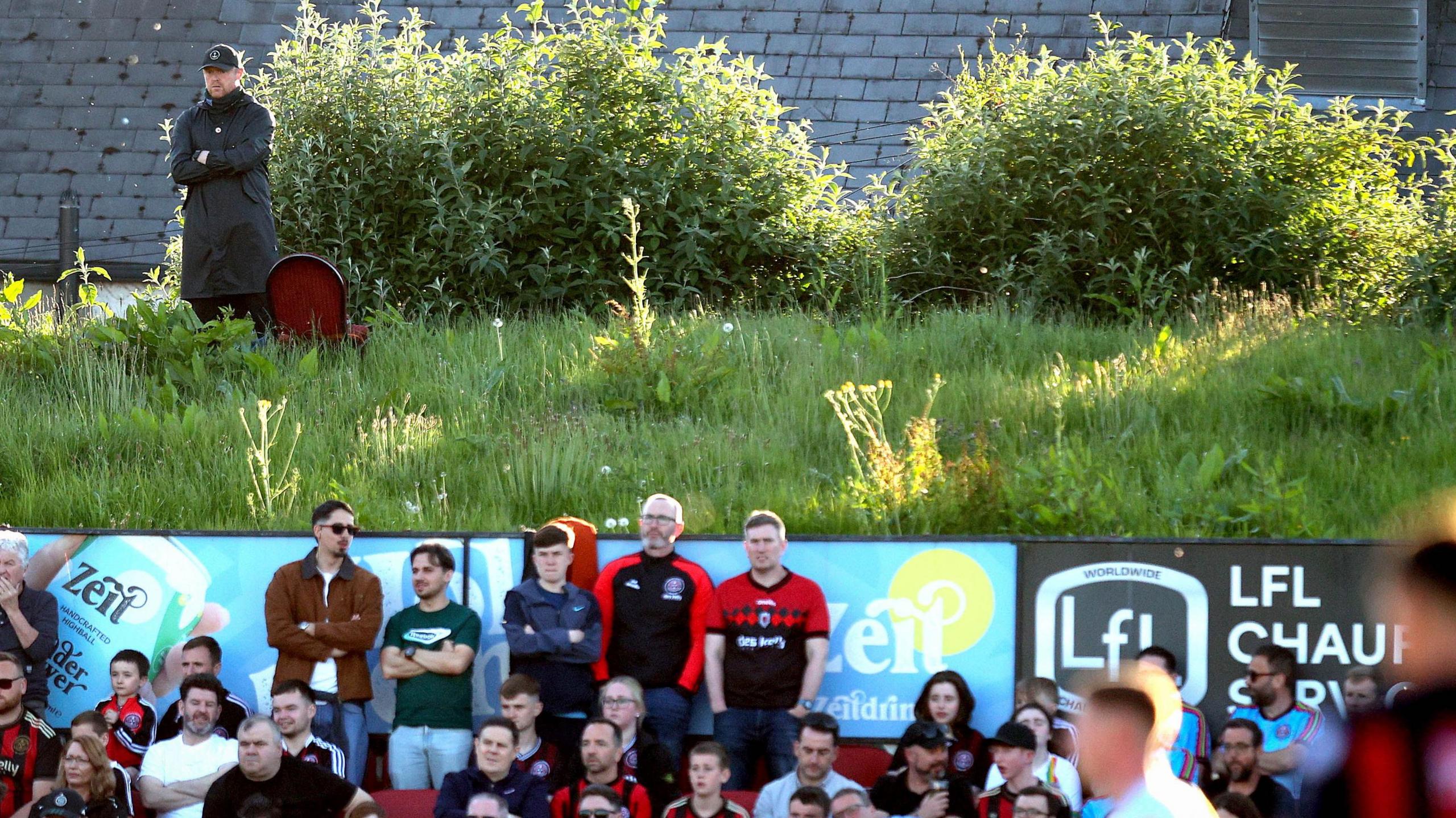 Damien Duff watches from the top of the hill
