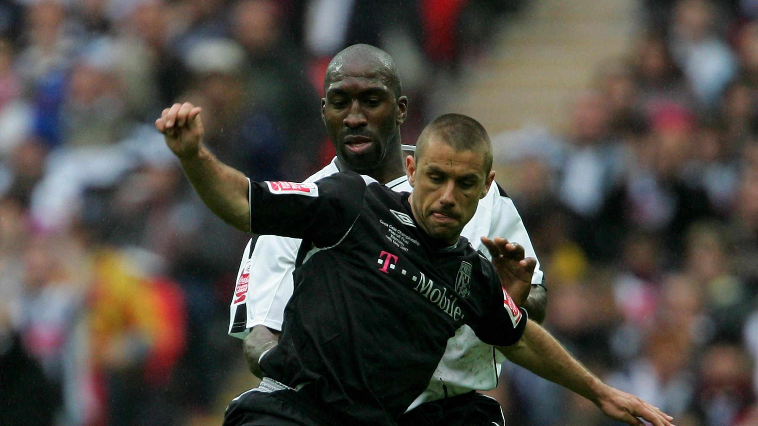 Kevin Phillips holding off Derby defender Darren Moore