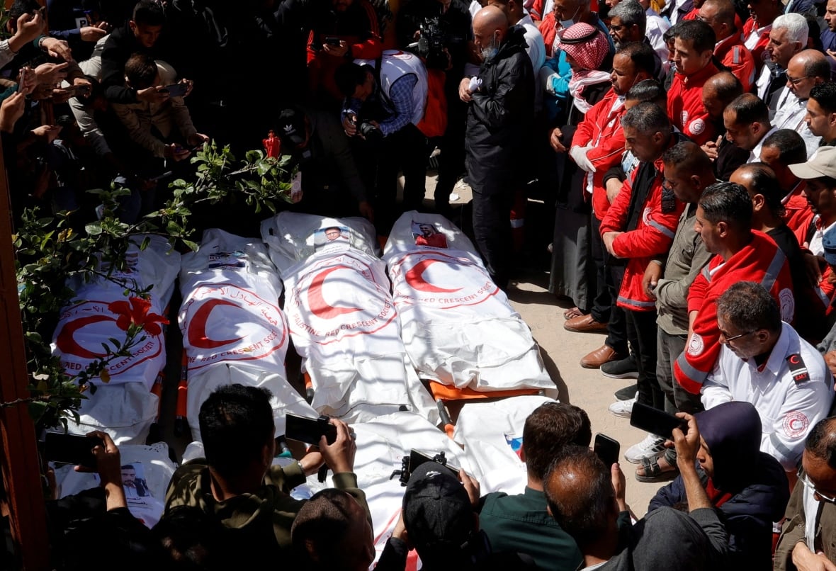 FILE PHOTO: Palestinians mourn medics, who came under Israeli fire while on a rescue mission, after their bodies were recovered, according to the Red Crescent, at Nasser hospital in Khan Younis in the southern Gaza Strip March 31, 2025.