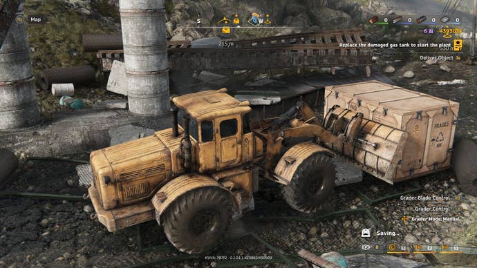 A bulldozer attempts to break a big wooden crate.