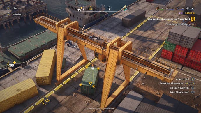 A cargo crane lifts a shipping container.