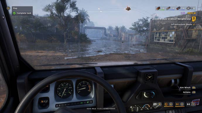 The player drives a car in first-person perspective through a rainy environment.