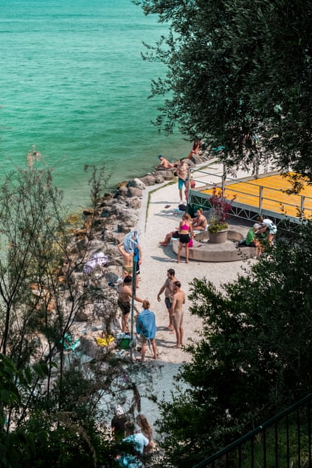 Tourists relax on the beach