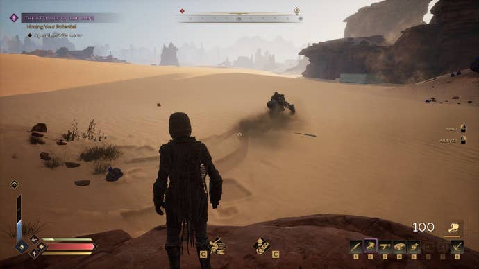 The player watches as another player scoots off on a sandbike.