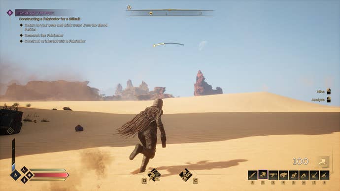 The player runs across the desert sands in the heat of the sun.