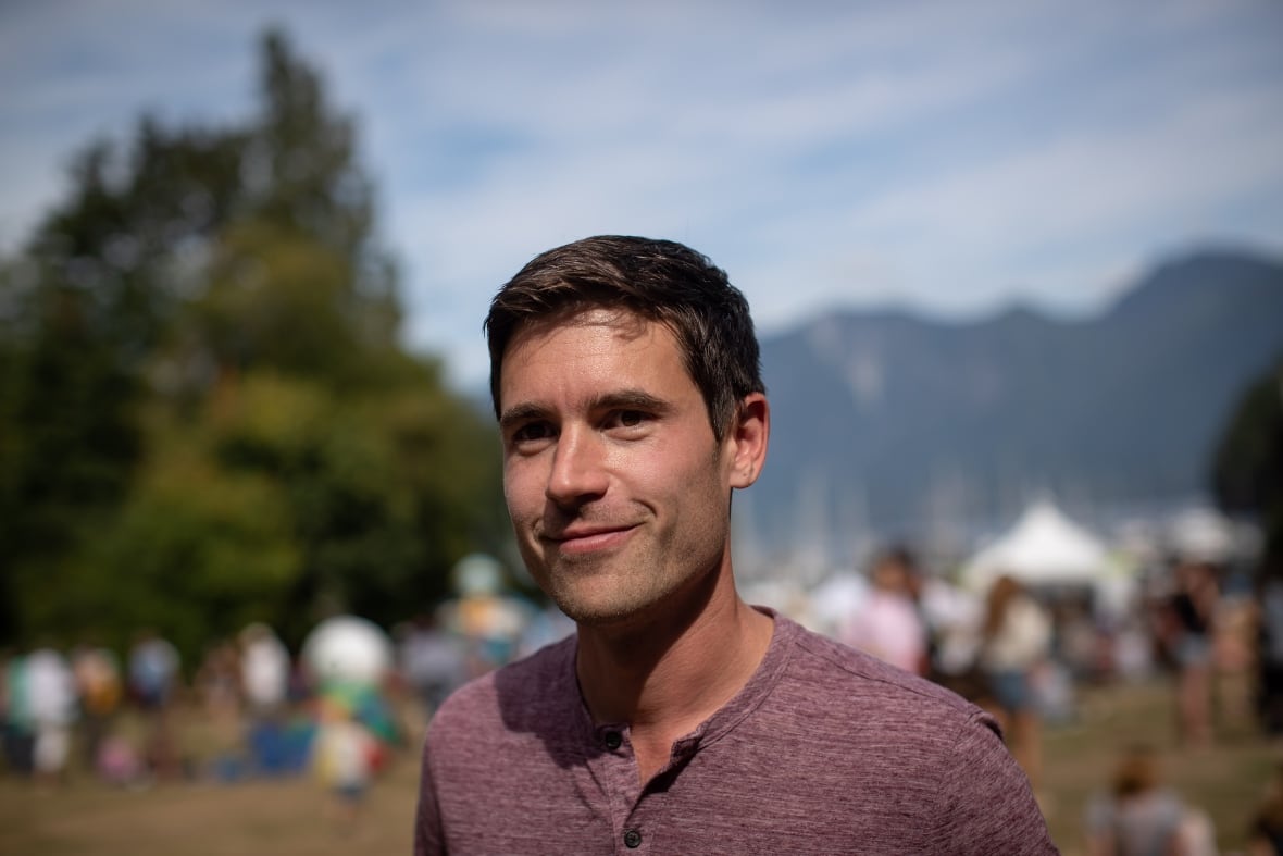 A man in a red t-shirt.