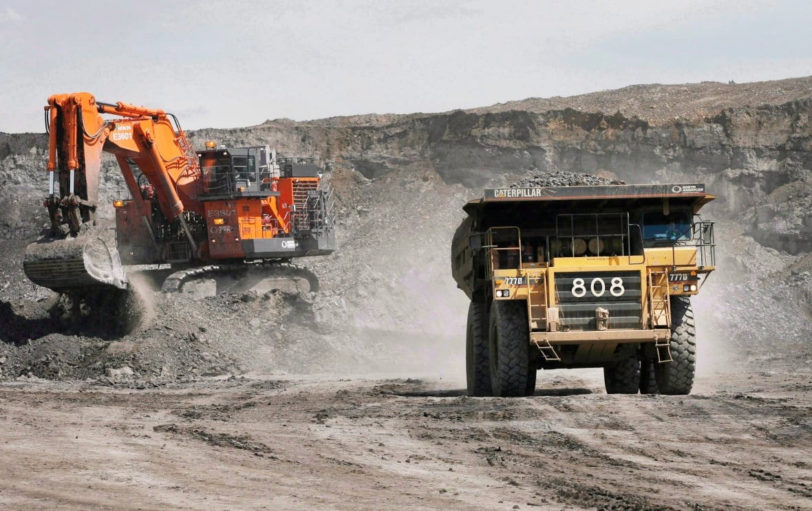A haul truck carrying a full load drives away from a mining shovel at the Shell Albian Sands oilsands mine near Fort McMurray, Alta., Wednesday, July 9, 2008. If low oil prices stick around much longer, the operations manager at Lac La Biche Transport Ltd. says he will have to layoff workers. These aren't the massive truck-and-shovel mining operations north of Fort McMurray, Alta. that tend to come to mind when one thinks of the oilsands.