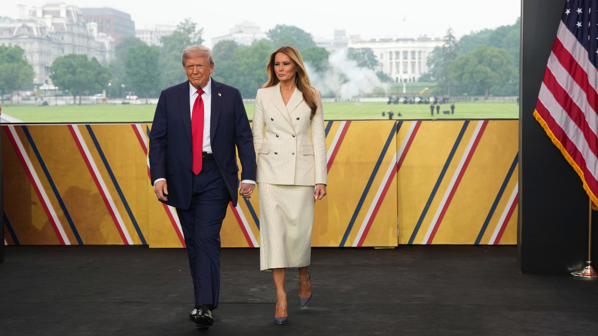 President Donald Trump and first lady Melania Trump arrive for a parade to honor the Army's 250th anniversary, coinciding with Trump's 79th birthday, June 14, 2025, in Washington. 