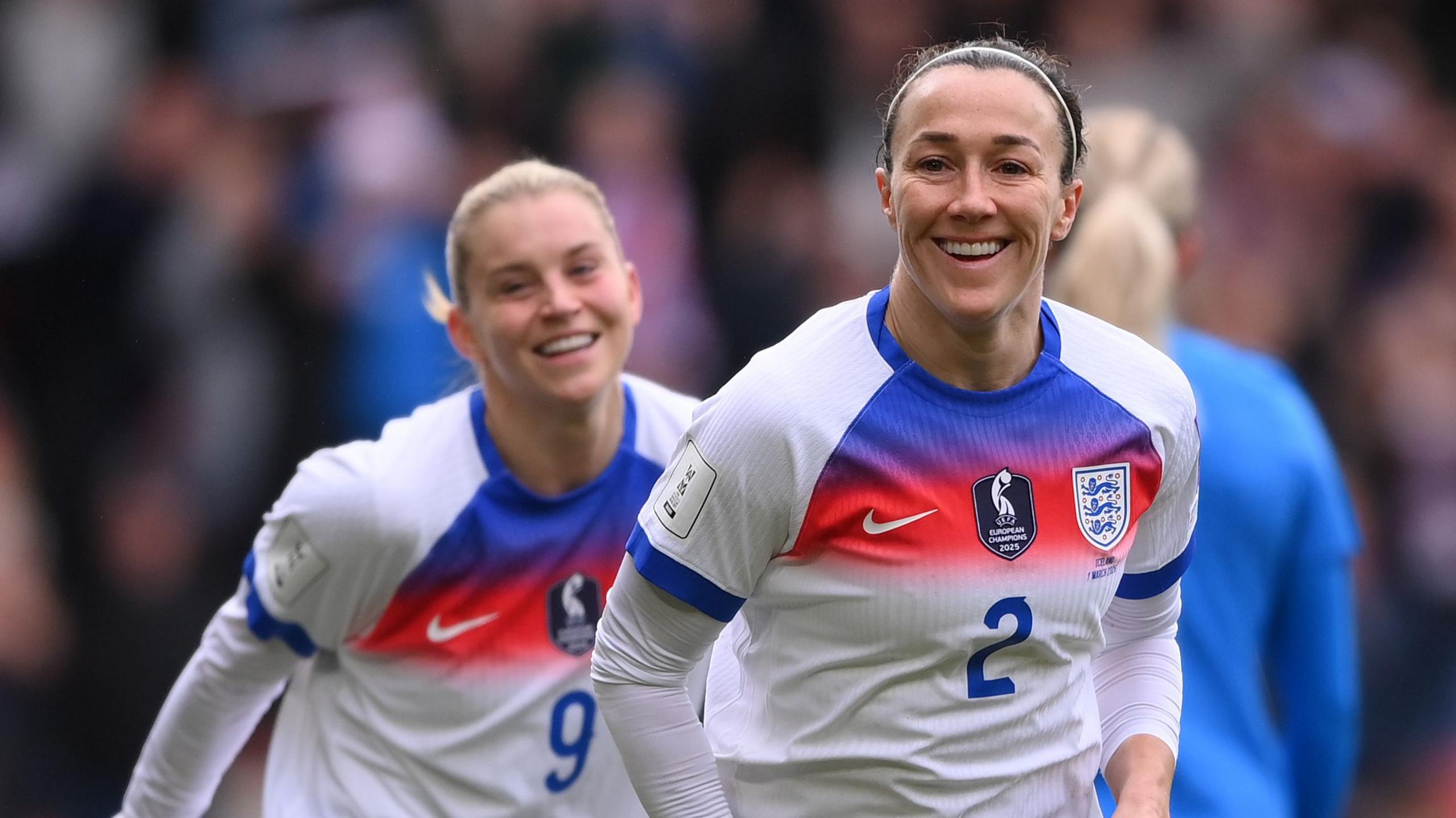 A smiling Lucy Bronze celebrates opening the scoring for England