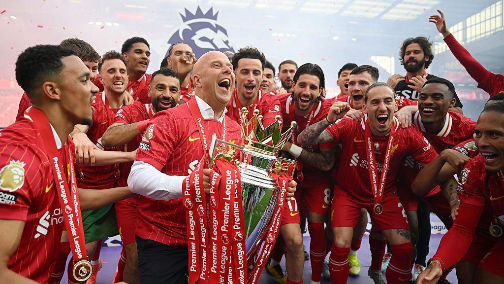 Image of Arne Slot, manager of Liverpool lifting the Premier League trophy with his team after the Premier League match between Liverpool FC and Crystal Palace FC at Anfield on May 25, 2025