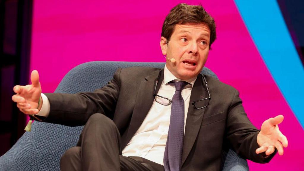 Andrea Traverso, Uefa's director of financial sustainability and research, gestures with his hands