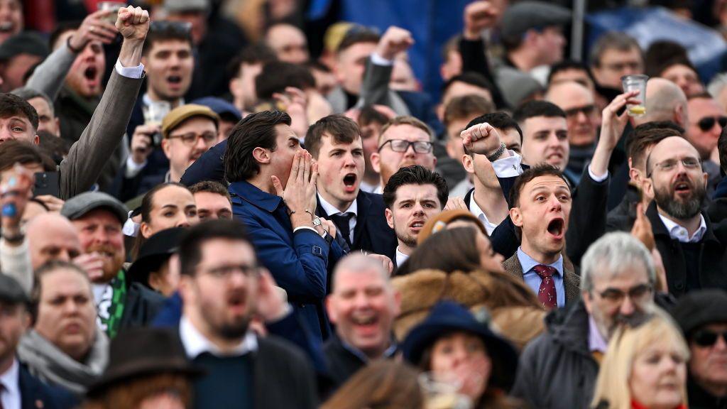 Racegoers react during The Mrs Paddy Power Mares' Steeple Chase