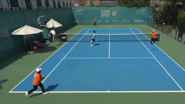 Players and officials run off court at the ATP Challenger event in Fujairah