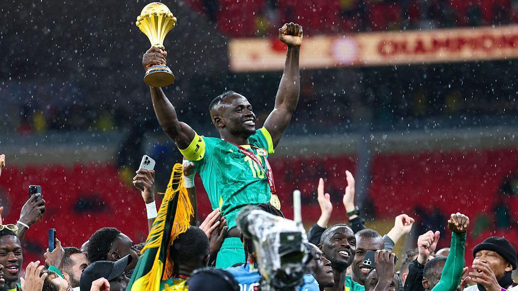 Senegal captain Sadio Mane celebrates winning Afcon