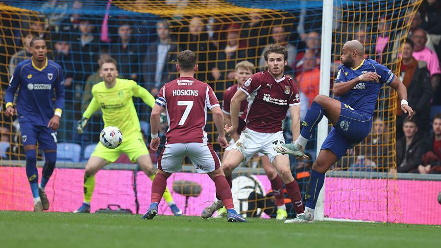 Action from Northampton's League One match at AFC Wimbledon
