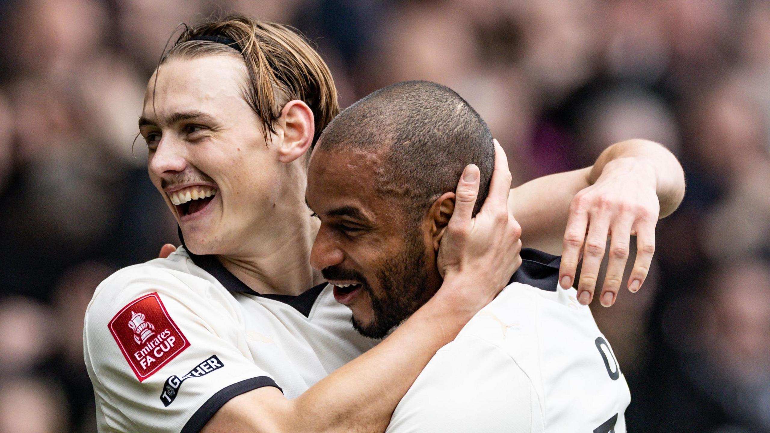 Ben Waine celebrates with Funso Ojo