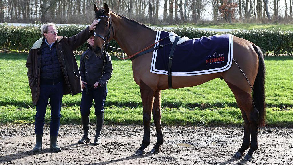 Harry Redknapp touching the head of Jukebox Man