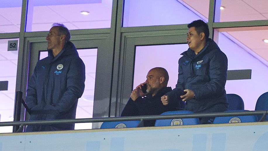 Pep Guardiola on the phone