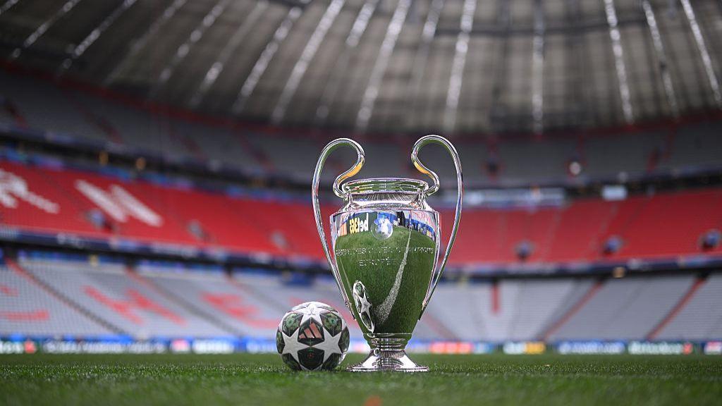 Champions League trophy inside a stadium