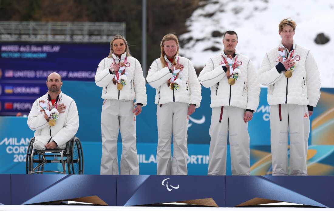 Joshua Sweeney, Oksana Masters, Sydney Peterson, Jake Adicoff and his guide Reid Goble of Team United States participate in the medal ceremony after the Para Cross-Country Skiing Mixed 4x2.5km Relay in Val di Fiemme, Italy