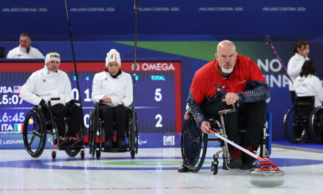 American Steve Emt competes in Sunday's mixed doubles match against Italy, which the U.S. won.