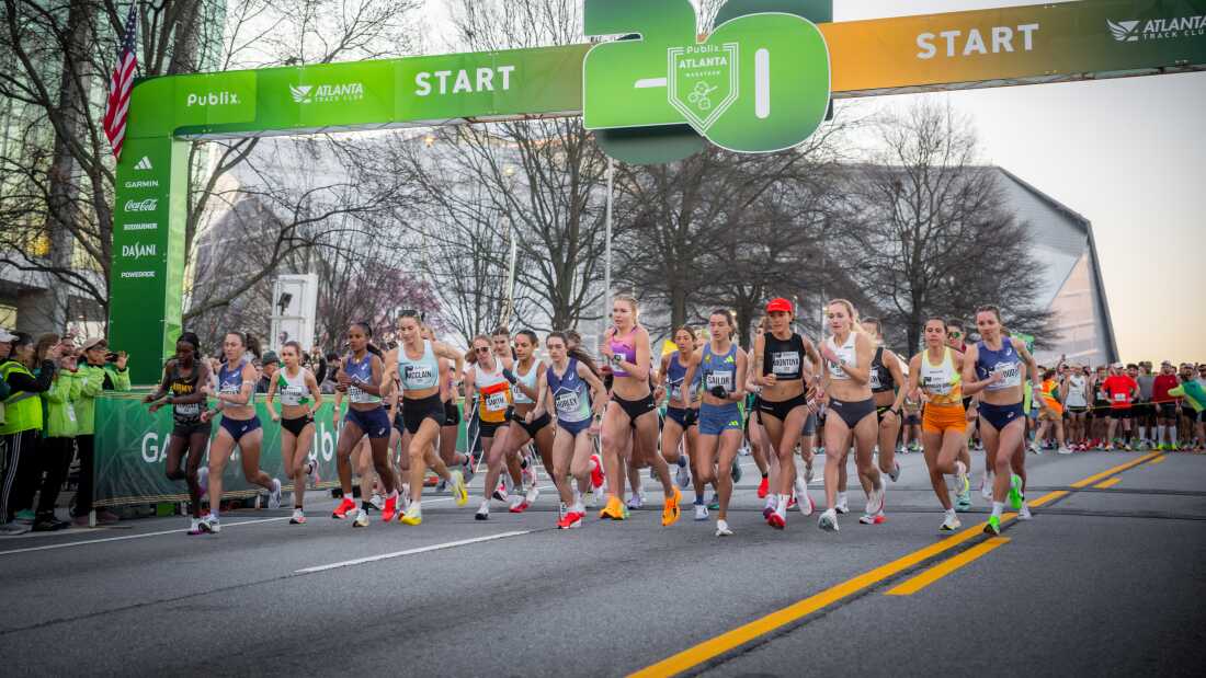 Elite female distance runners take off at the start of the Atlanta Half Marathon on March 1. Jess McClain, middle left, led much of the race before an official car led her off course.