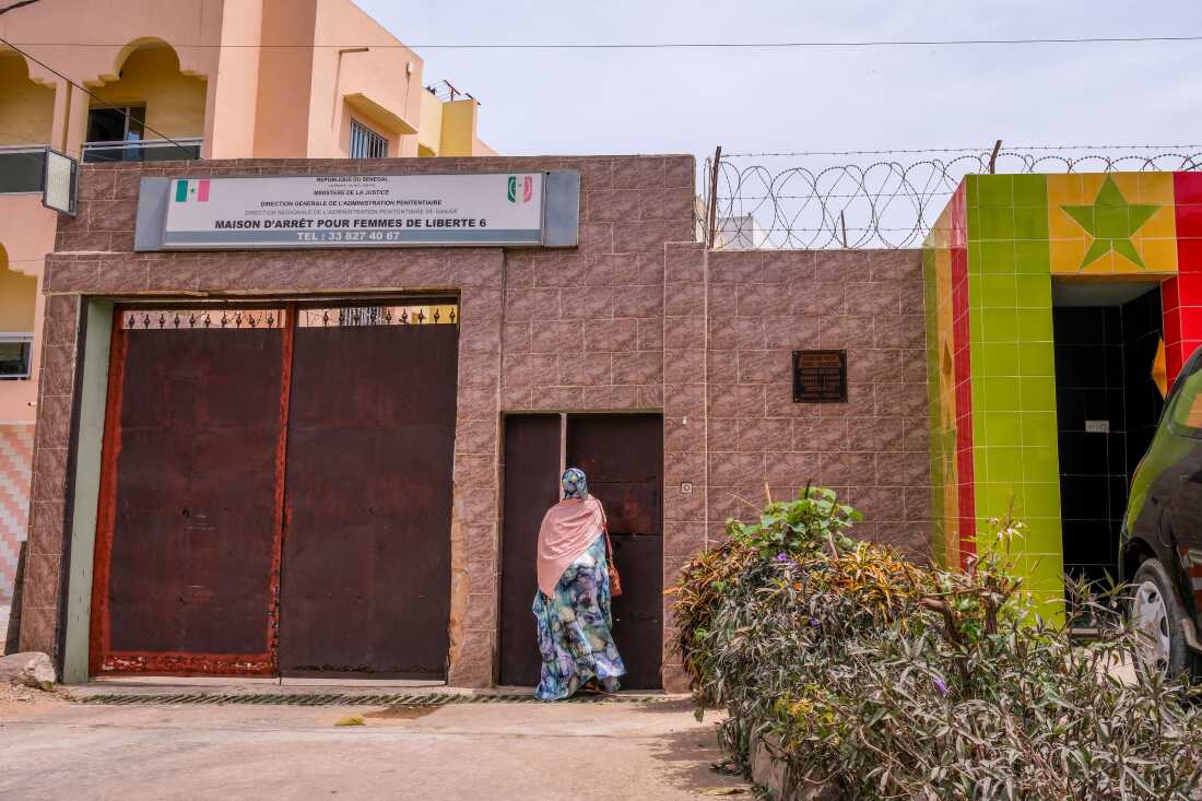Dakar, Senegal (March 8, 2026) - Fatou Faye, a supervisor for the prison project with Tostan, a Senegal-based human rights non-governmental organization, enters a women's prison in Dakar, Senegal for an International Women's Day celebraton.