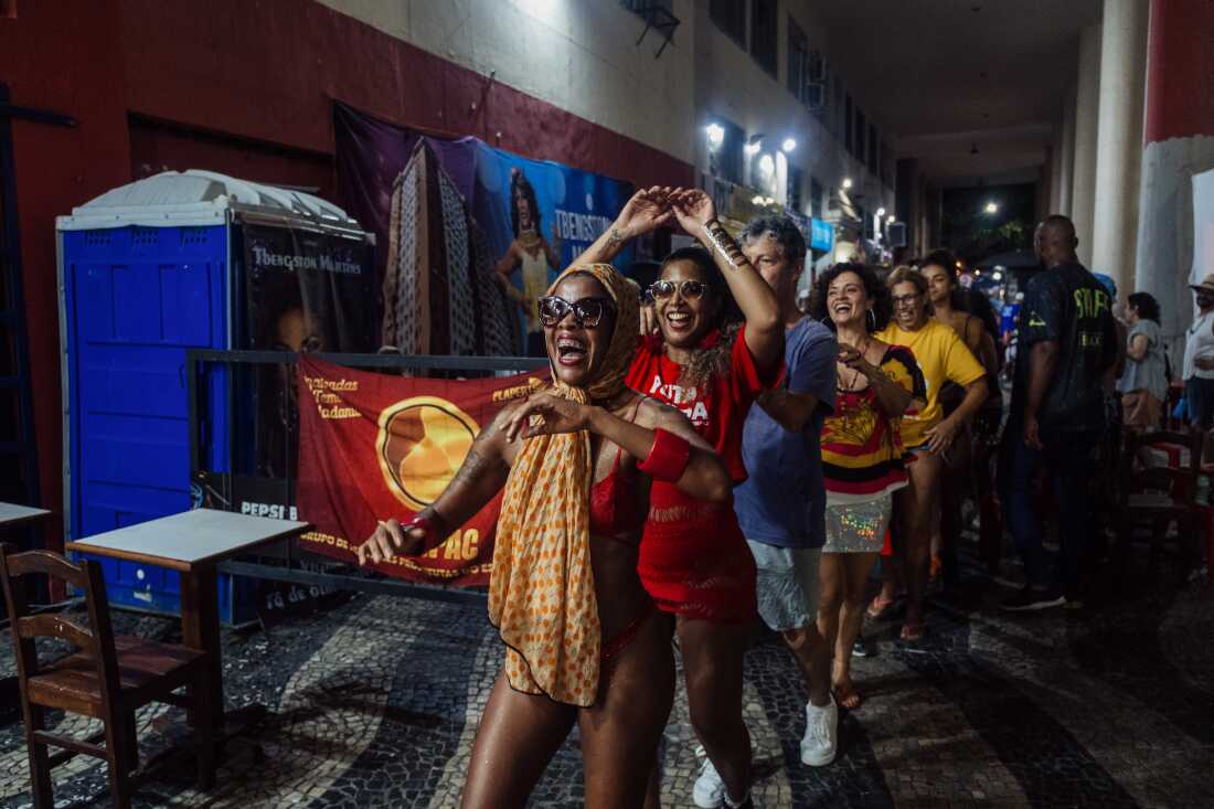 Members of Puta Davida, a feminist collective advocating for the labor and human rights of sex workers, take part in the final march of a public action during Carnival in downtown Rio de Janeiro, Brazil, on Feb. 14, 2026. The event reclaimed the historic Mangue area &mdash; once officially designated as a prostitution zone in the early 20th century &mdash; and sought to assert political representation, collective memory and labor rights for sex workers. I chose this image because it shows how sex workers intervene in one of Brazil&rsquo;s most symbolic cultural moments to challenge their own representation. By organizing during Carnival, the collective transforms a festive space into a platform for political visibility and historical accountability. Previously published in Brasil de Fato, Feb. 16, 2026. Link: https://www.brasildefato.com.br/2026/02/16/antes-de-desfilar-na-sapucai-prostitutas-de-varias-geracoes-ocupam-o-edificio-balanca-mas-nao-cai-para-discutir-memoria-e-representacao/