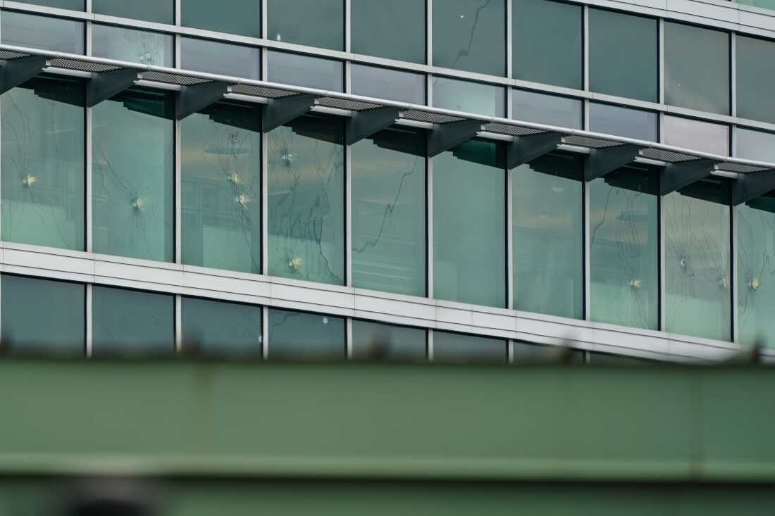 Bullet holes are seen in windows at the CDC's headquarters in Atlanta following a shooting that left two dead, on August 9, 2025.