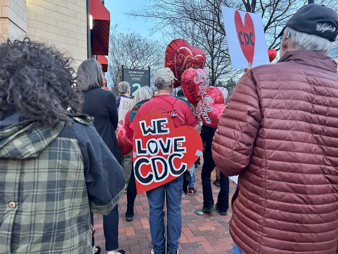 Dozens of protesters rallied across the street from the CDC campus in Atlanta, marking a year since the first mass firings began at the CDC under the Trump administration. The cuts affected thousands at multiple federal agencies, and began Feb. 13, 2025, and continued for several days after, leading many to call it the Valentine's Day Massacre.