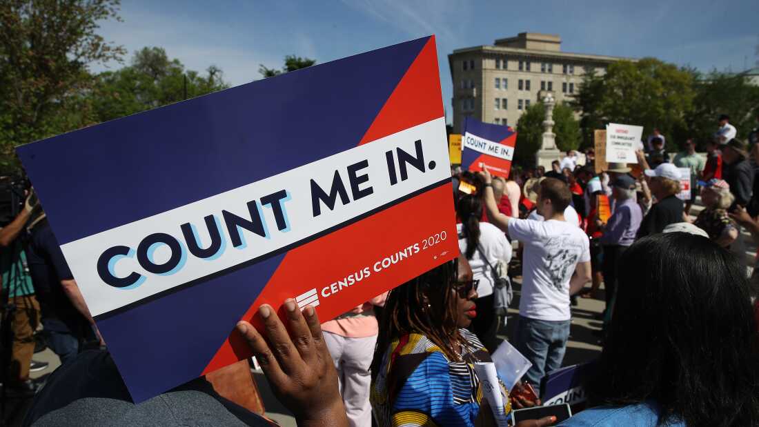 Protesters hold signs saying &ldquo;COUNT ME IN&rdquo; at a 2019 rally against the Trump administration&rsquo;s push for a census citizenship question outside the U.S. Supreme Court in Washington, D.C.