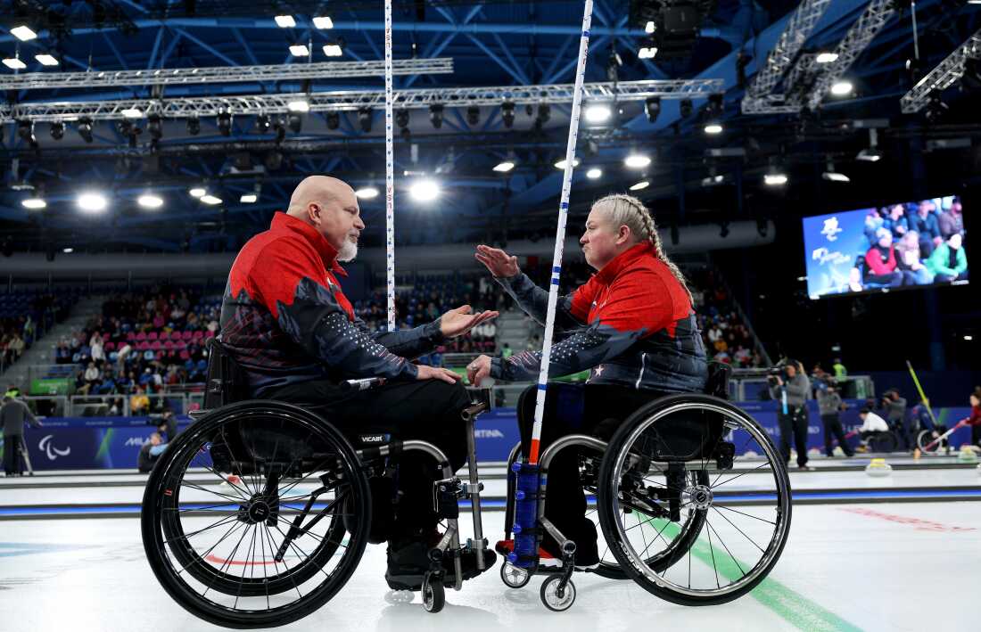 Steve Emt and Laura Dwyer celebrate during a match this week.