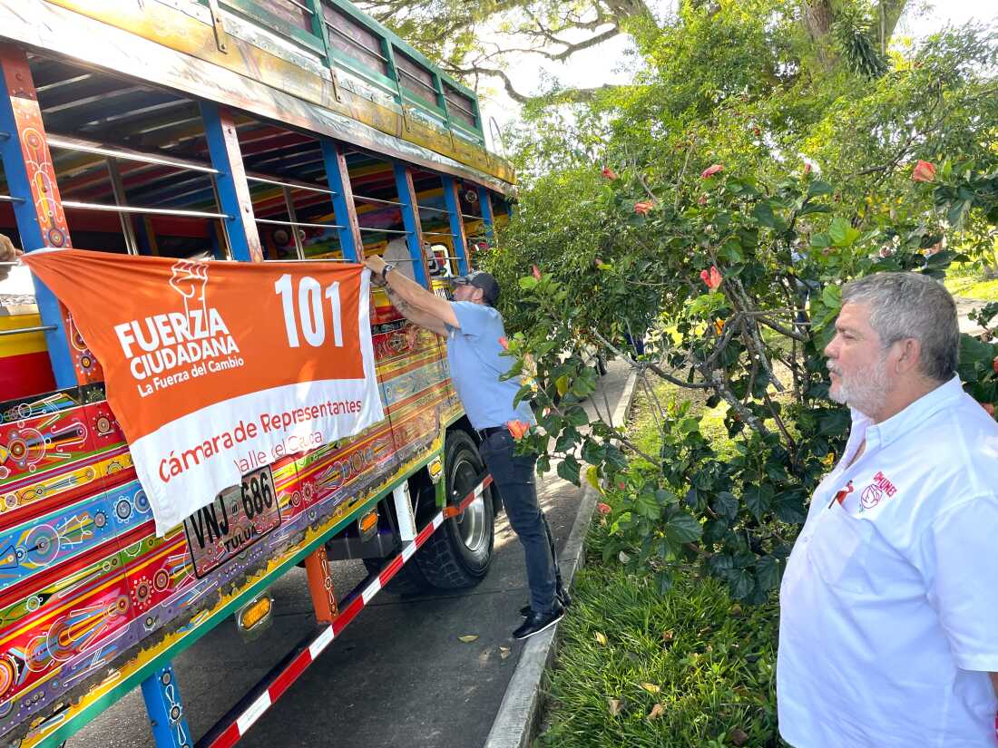 Luis Alb&aacute;n, next to his campaign bus. Alb&aacute;n, 68, is more accustomed to hiding who he is. He spent 40 years on the run as a high-ranking member of the Revolutionary Armed Forces of Colombia. Known as the FARC, it used to be the country&rsquo;s largest guerrilla group.