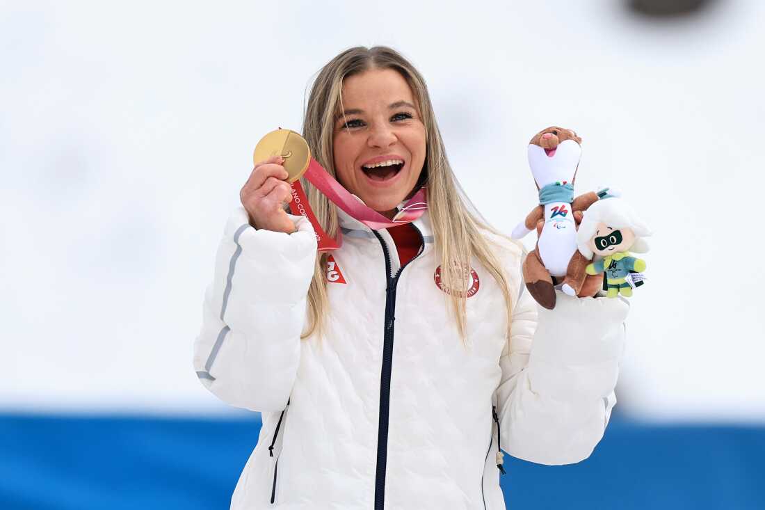 Oksana Masters poses with one of her gold medals in Italy.